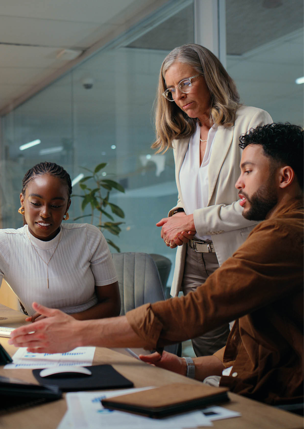 Business, people and meeting with tablet in office for review on financial statement and budget proposal. Mentor, accounting interns or feedback to manager on revenue report or sales analysis at desk